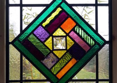 Mary Corkery - Large Green Bits - Traditional kiln fired stained glass panel – 32cm x 32cm