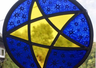 Mary Corkery - Yellow Hanging Star - Traditional kiln fired stained glass panel – 17.5cm diameter